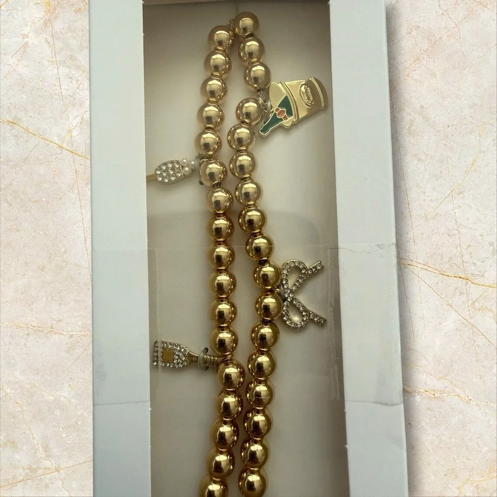 BaubleBar Gold Colored Beaded Phone Charm Wristlet Celebration Holiday New